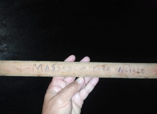 Bastão escrito ‘massagem para noiado’ é encontrado em ponto de venda de drogas, diz polícia